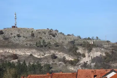 a hill with a house on top of it at Apartmani Varos & Restaurant in Pirot