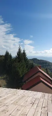 a roof of a building with a view of the mountains at Meseceva bajka 2 in Kopaonik