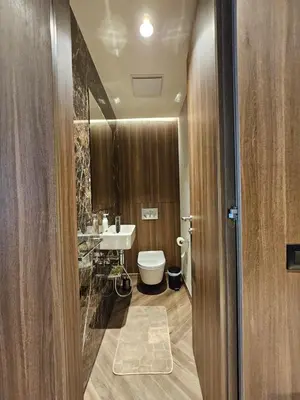 a bathroom with a toilet and a sink at Kopaonik Woodside Hotel SKI - SPA in Kopaonik