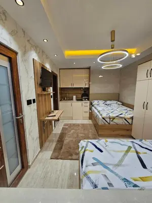 a large room with two beds and a kitchen at Ebra 75 Kraljevi Cardaci Kopaonik in Kopaonik