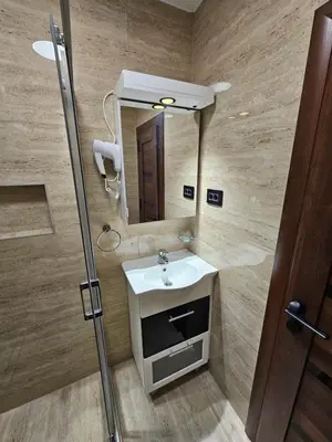 a bathroom with a sink and a mirror at Ebra 75 Kraljevi Cardaci Kopaonik in Kopaonik