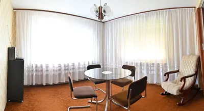 a room with a table and chairs and a window at Vikend Kuća Živković in Despotovac