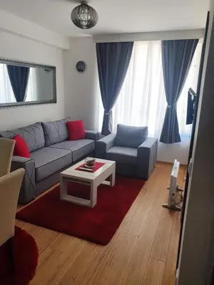 a living room with a couch and a coffee table at Tri srca - Kraljevi Cardaci in Kopaonik