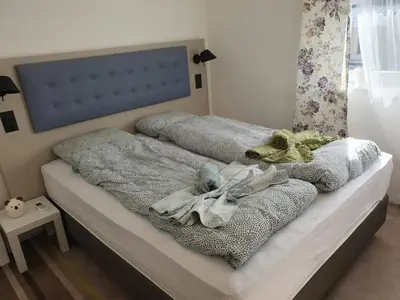 a bedroom with a bed with stuffed animals on it at Vila LELA in Vrnjačka Banja