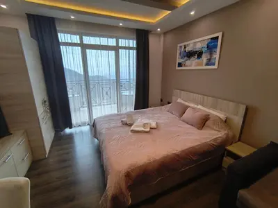 a bedroom with a bed with two towels on it at Milmari M9 in Kopaonik