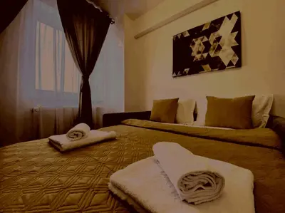 a hotel room with two beds with towels on them at Prelepa prostrana kuća in Šipačina