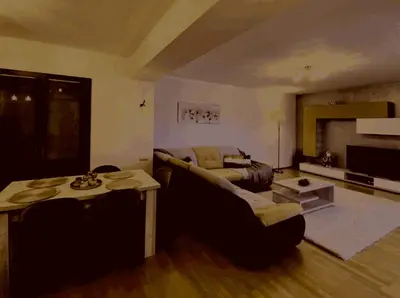 a living room with a couch and a table at Prelepa prostrana kuća in Šipačina