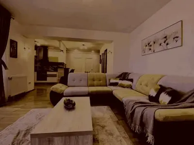 a living room with a couch and a coffee table at Prelepa prostrana kuća in Šipačina