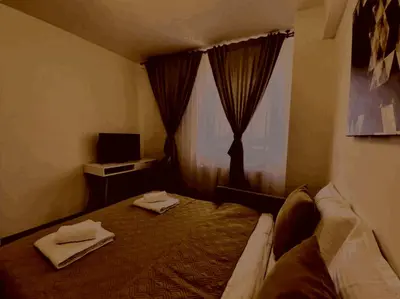 a bedroom with a bed with two towels on it at Prelepa prostrana kuća in Šipačina