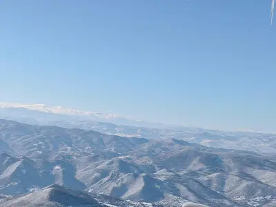 an aerial view of a mountain range with snow at Lawa Apartments Kopaonik in Cajetina