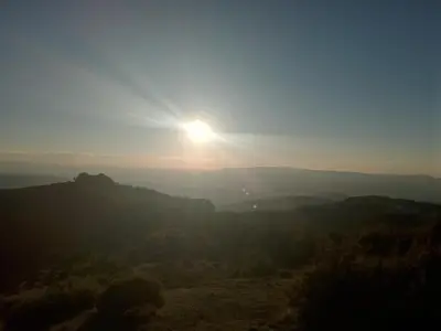 a view of the sun setting over the mountains at Studio SimpaKop in Kopaonik
