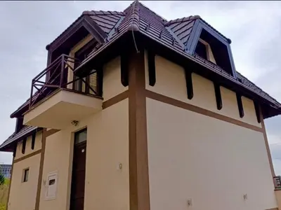 a building with a balcony on top of it at Apartment Mountain View Haven in Kopaonik