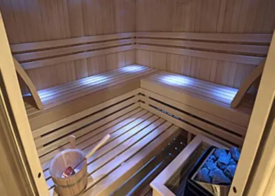an inside of a sauna with a bucket in it at Apartment Mountain View Haven in Kopaonik