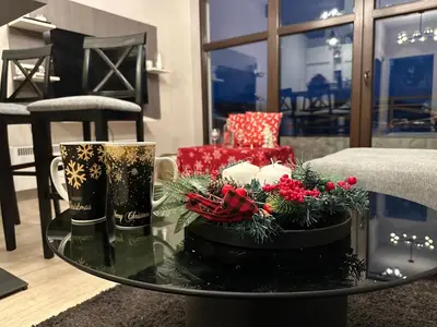 a living room with christmas decorations on a table at Apartment Mountain View Haven in Kopaonik