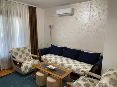 a living room with a couch and chairs and a table at Domacinstvo Markovic in Prekopčelica