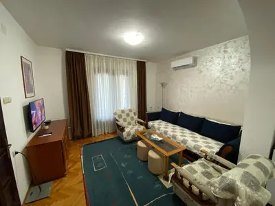 a living room with a couch and two chairs at Domacinstvo Markovic in Prekopčelica