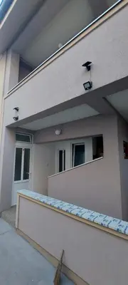 a building with two windows and a counter in front of it at Studio Zverko in Soko Banja