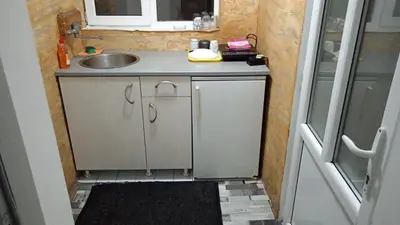 a small bathroom with a sink and a counter top at Studio Zverko in Soko Banja