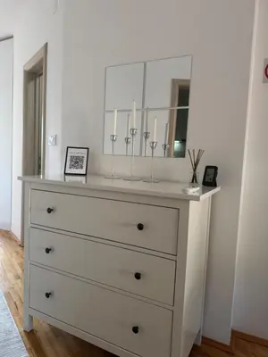 a dresser with a mirror on top of it at Apartman Petrovic in Vranje