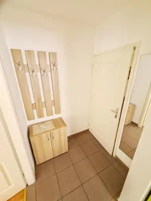a room with a door and a box on the floor at Maja Vujković Apartman 1 in Soko Banja