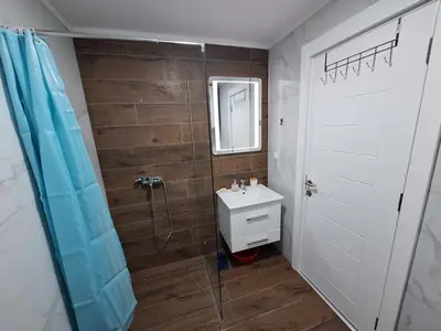 a bathroom with a sink and a shower at Apartman Šara in Vrnjačka Banja