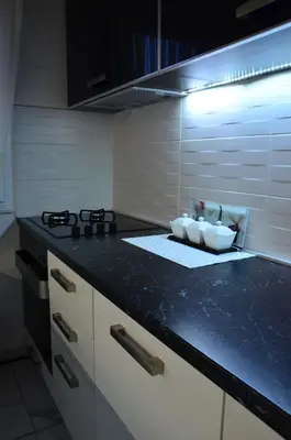 a kitchen with a counter top with a sink at Deluxe Jade Apartmens in Niš