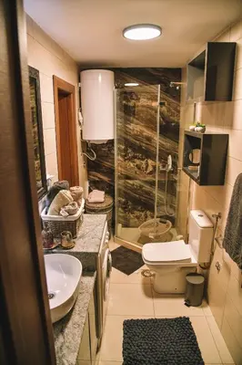 a bathroom with a shower and a toilet and a sink at Vila harmony in Trmčare