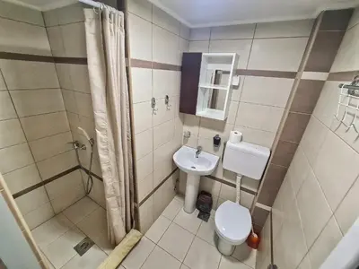 a small bathroom with a toilet and a sink at Vila Aleksandra 2 Apartman 1 in Soko Banja