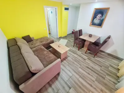 a living room with a couch and a table at Vila Aleksandra 2 Apartman 1 in Soko Banja