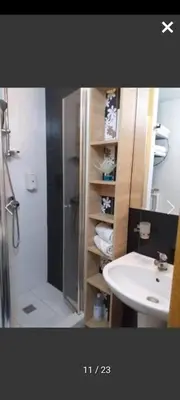a bathroom with a shower and a sink and a shower at Apartmani Iva Kop Konaci in Kopaonik