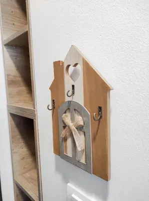 a heart shaped box with a bow on a wall at Vila Montana, Kopaonik, Apartman Ivony in Kopaonik
