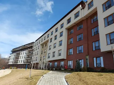 a largeartment building with a brick at Kopaonik - Milmari resort S66 in Kopaonik