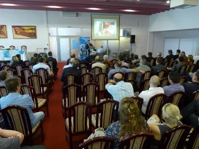 a group of people sitting in chairs in a room at Prenociste Gazela in Pirot