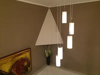 a room with three lights hanging from the ceiling at Prenociste Gazela in Pirot