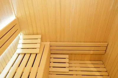 a small sauna with wooden walls and ceilings at Vila Golija VM Apartment in Kopaonik
