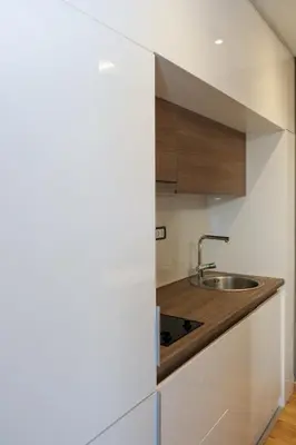 a kitchen with a sink and a counter at Vila Golija VM Apartment in Kopaonik