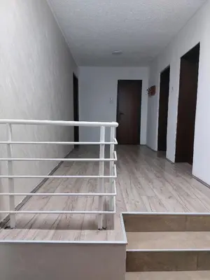 an empty room with a white bunk bed in it at R Apartments in Paraćin