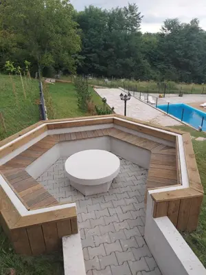 a toilet sitting on a patio next to a pool at Apartman Nina VB in Vrnjačka Banja