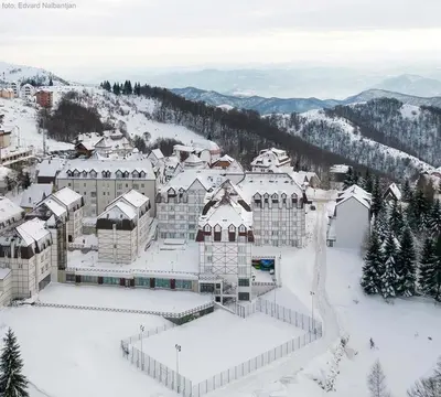 a large building in the snow with snow on it at Kraljevi Cardaci, Kopaonik, Lux apartman 9C-71 in Kopaonik