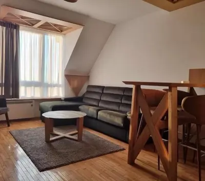 a living room with a couch and a table at Kraljevi Cardaci, Kopaonik, Lux apartman 9C-71 in Kopaonik