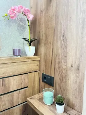 a table with a vase with a flower in it at R2 KOP Konaci in Kopaonik