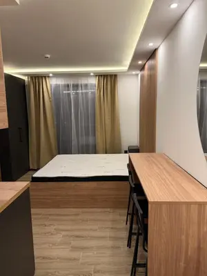 a room with a bed on top of a table at Sophie & Sarah Apartments - Residence Hill, Kopaonik in Kopaonik
