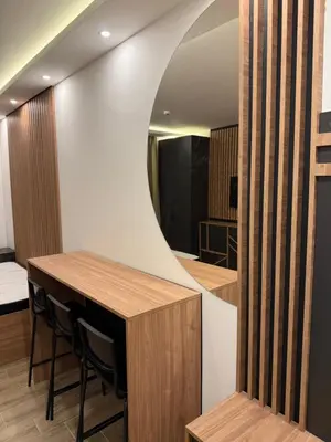 a dining room with a table and a mirror at Sophie & Sarah Apartments - Residence Hill, Kopaonik in Kopaonik