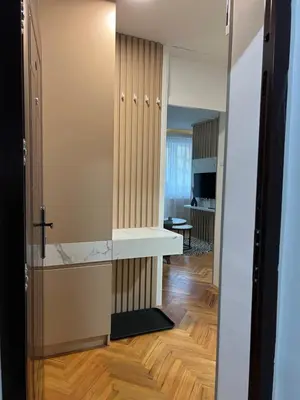 a hallway with a door leading into a room at NOMAD Studio in Niš
