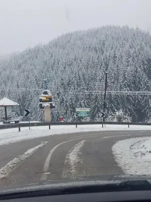 a snow covered mountain with a road and a lighthouse at Sobe za izdavanje Nedeljković in Lukovo