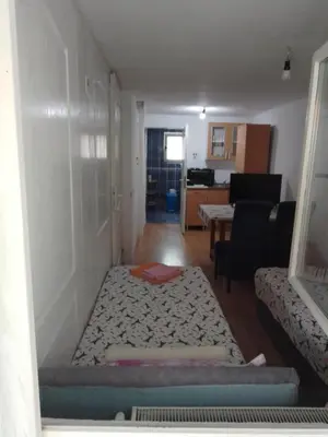 a room with a bed in the corner of a room at Sobe za izdavanje Nedeljković in Lukovo