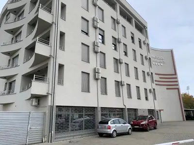 two cars parked in front of a building at Sofija lux in Jagodina