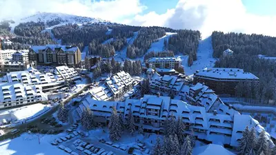 an aerial view of a resort in the snow at SKI MONTIS apartmani - Kopaonik centar in Kopaonik