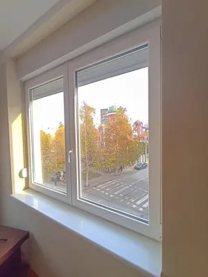two windows in a room with a view of a street at Fontana in Kruševac
