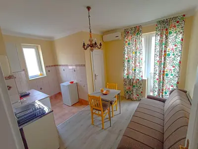 a living room with a couch and a table at Fontana in Kruševac